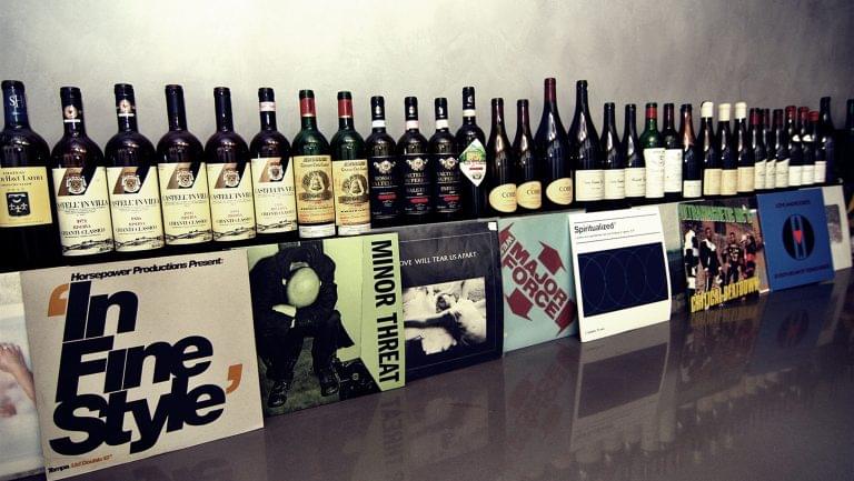 Bottles on top of vinyls